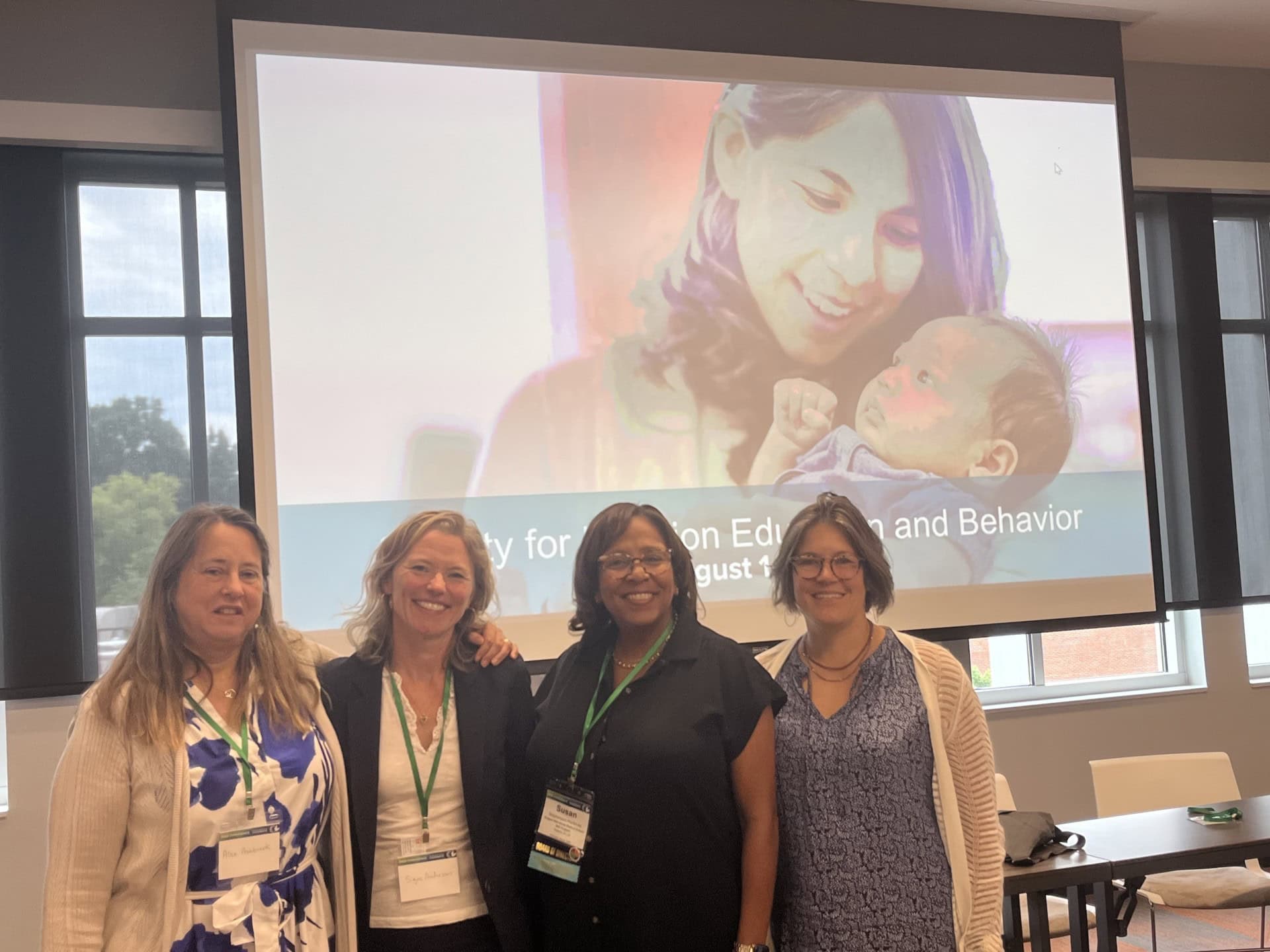 Speakers for a WIC CIAO panel at the Society for Nutrition Education and Behavior Conference in July 2024 stand in a line. Alex Ashbrook, Director of WIC and Root Causes at FRAC; Julie Skolmowski, Senior Technical Adviser at USDA; Susan Stephenson-Martin, WIC Director at Rutgers NJMS; and Signe Anderson, Senior Director of Nutrition Advocacy at Tennessee Justice Center are pictured.